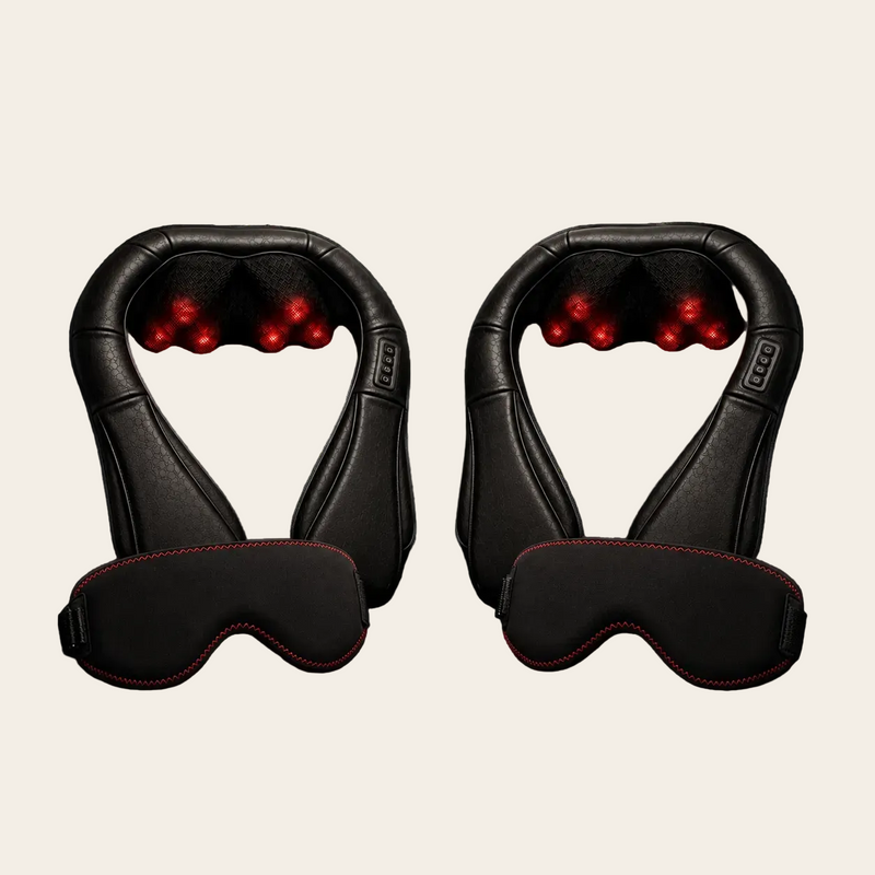 Two black neck and shoulder massage chairs with red LED light massage nodes, shown side by side on a dark reflective surface with matching black eye masks in front.